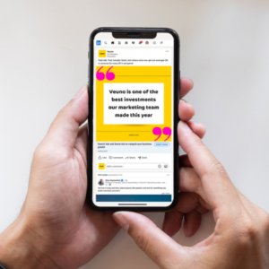 A photo of someone holding a mobile phone showing a LinkedIn ad for Veuno